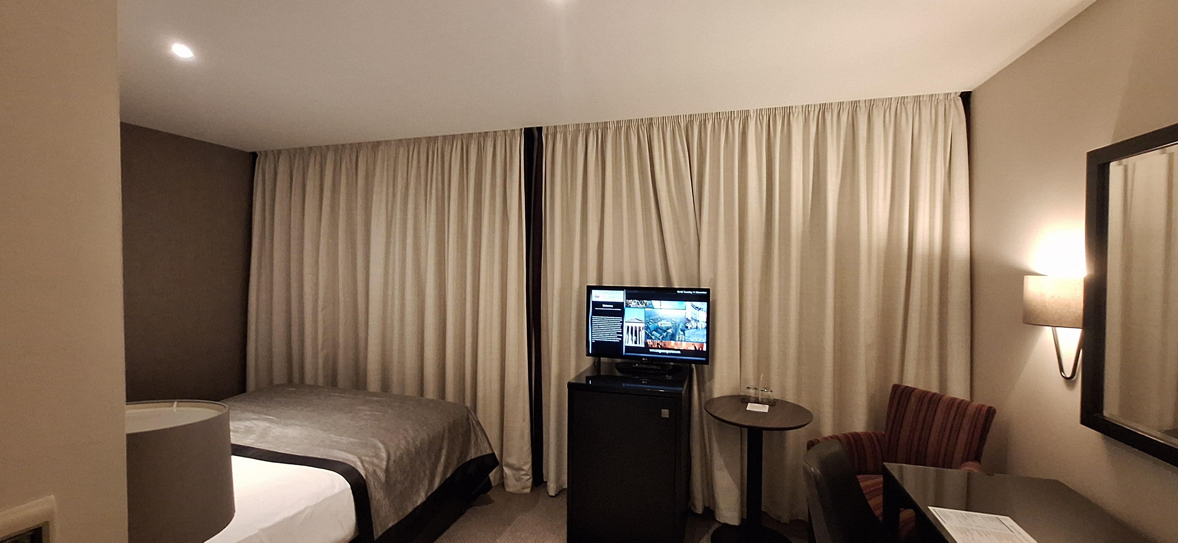 3 huge windows covering all 1 wall