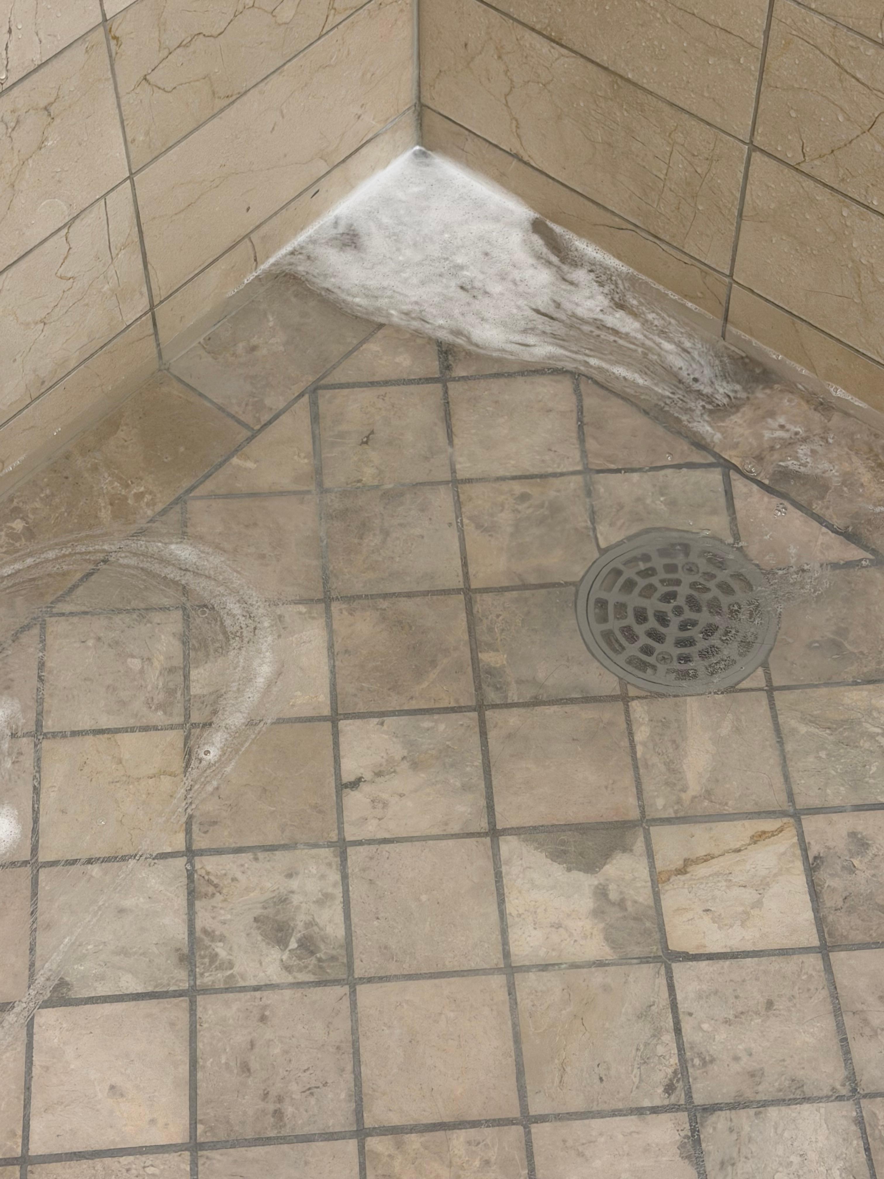 The shower drain failed to keep up with the shower.