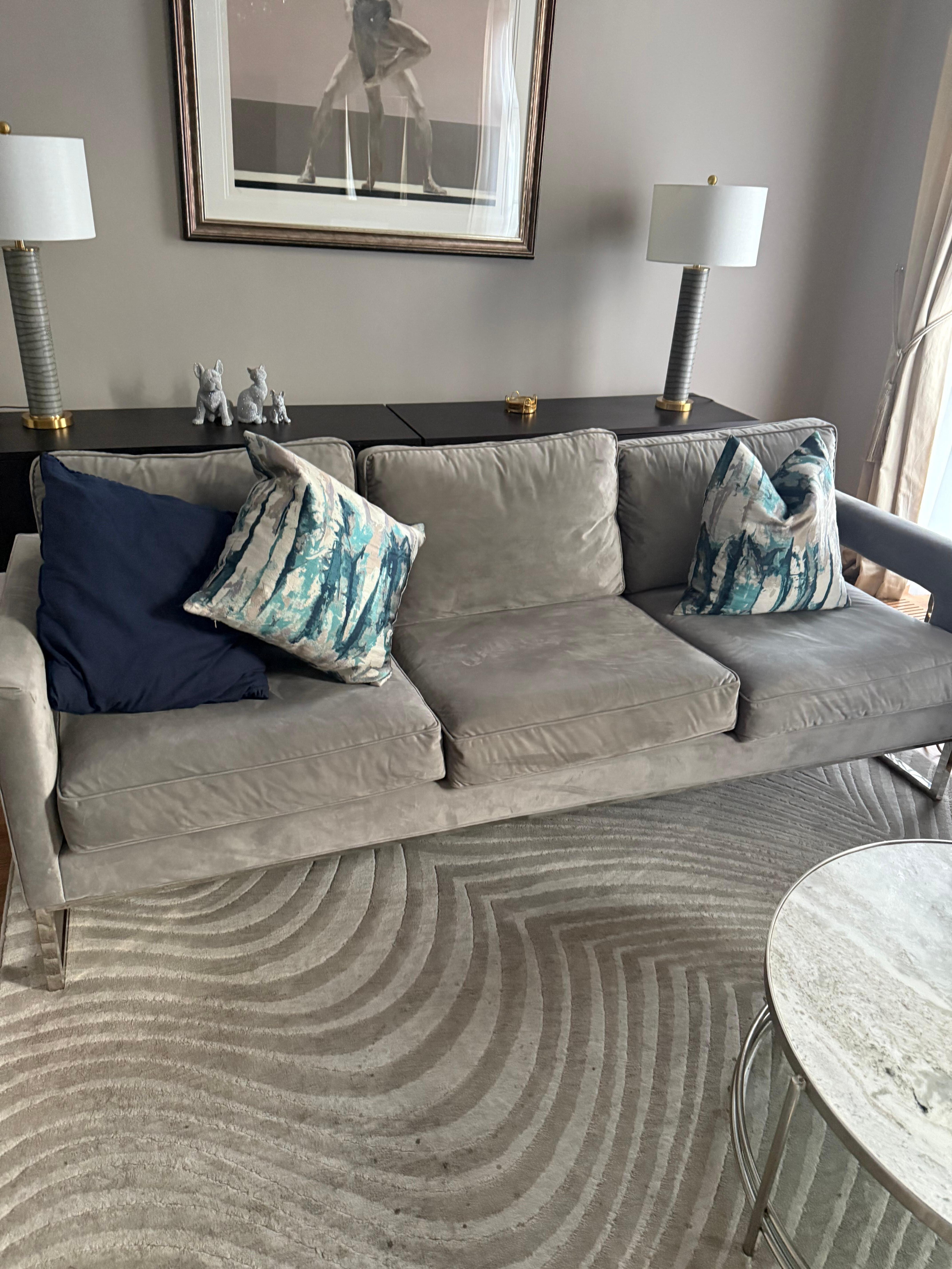 This is what the furniture in the living room really looks like. Grey stained polyester 