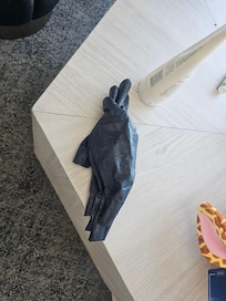 Clean glove left behind after room cleaning