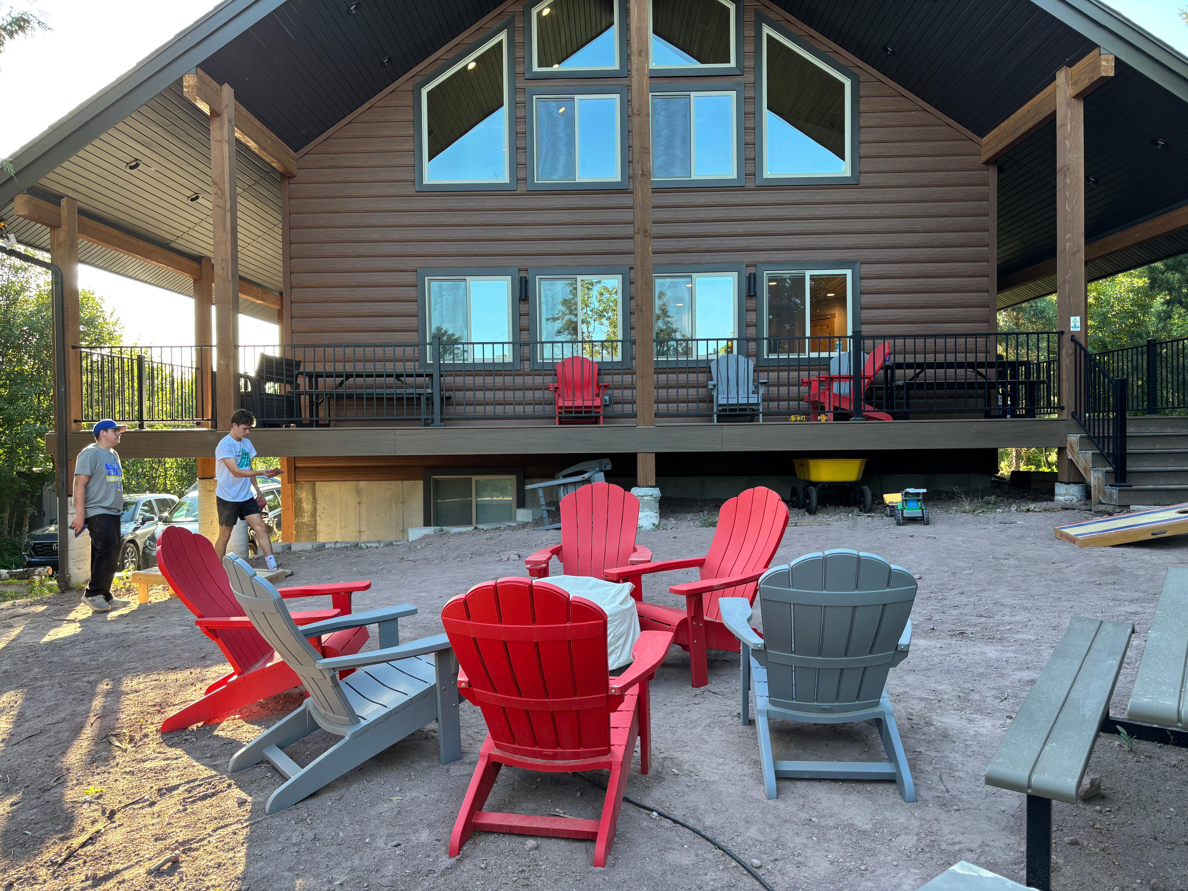 Outside with deck and chairs around the fire pit