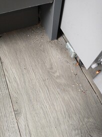 Kitchen floor next to the refrigerator