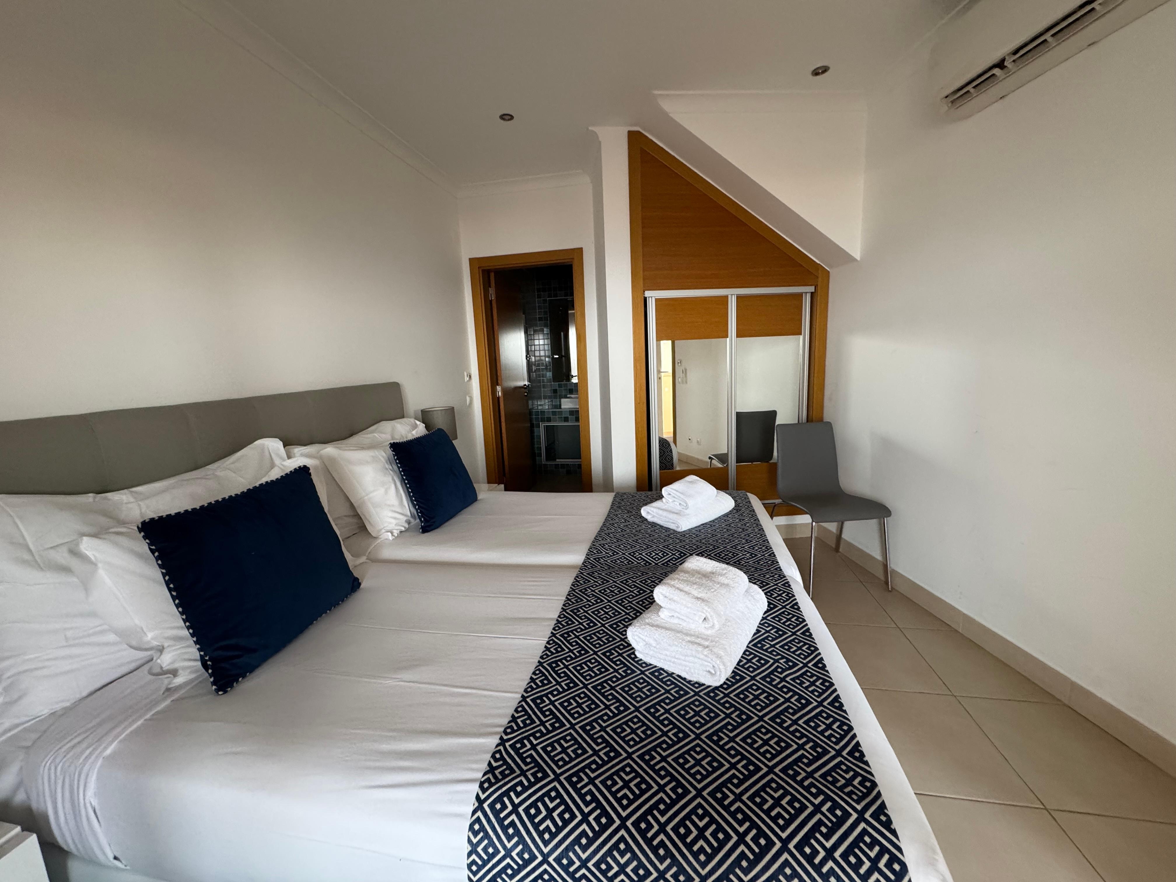 Second bedroom with queen bed and a bathroom.