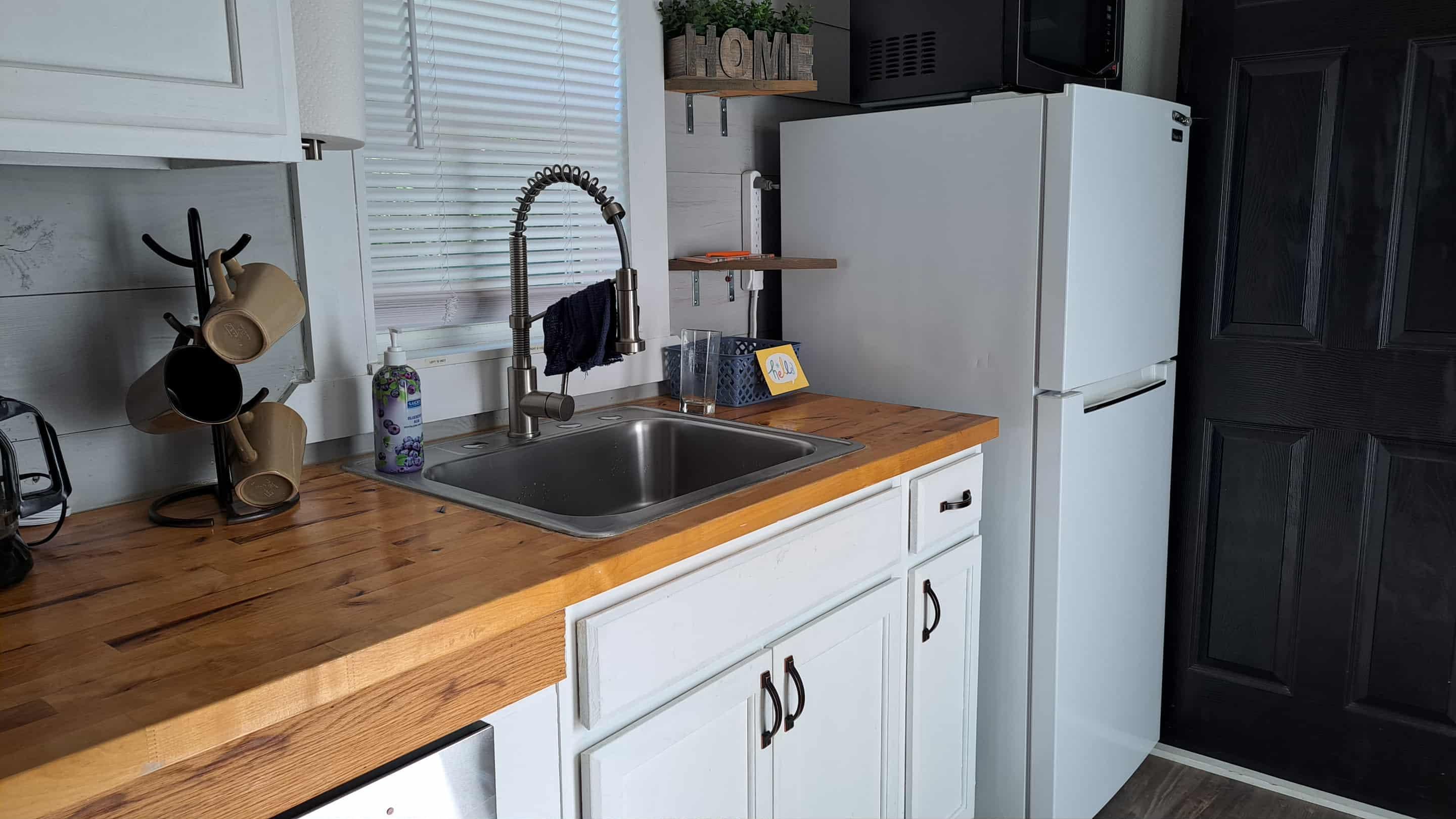 Kitchen includes an oven and a 2 burner hot-plate