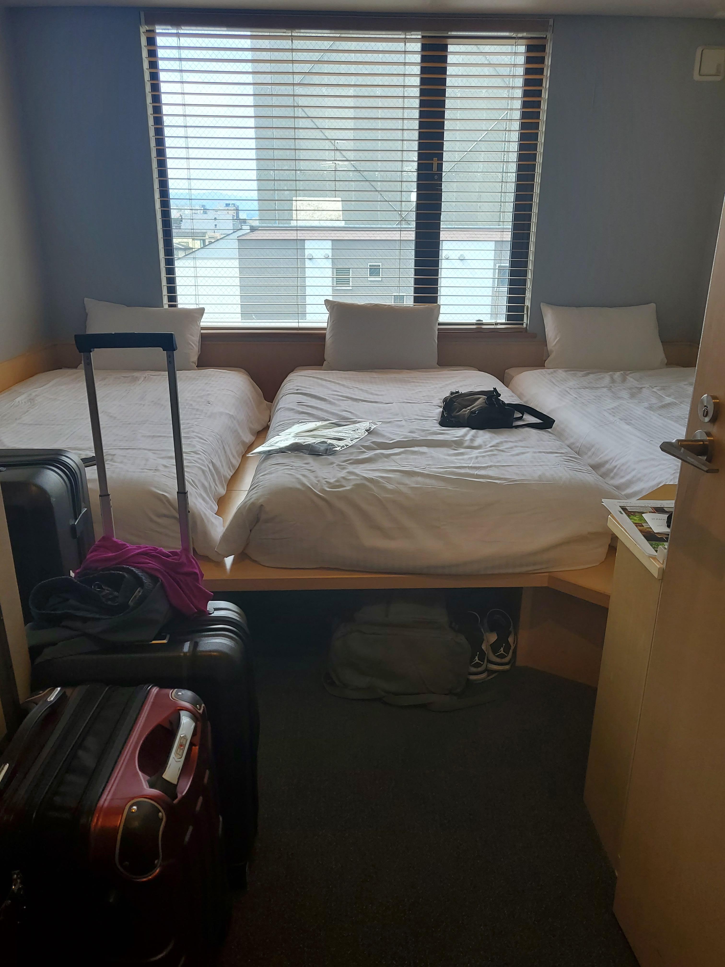 5 steps from the door and there's the bed! 3 person room with raised platform beds 