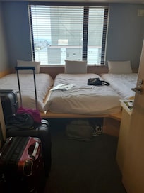 5 steps from the door and there's the bed! 3 person room with raised platform beds