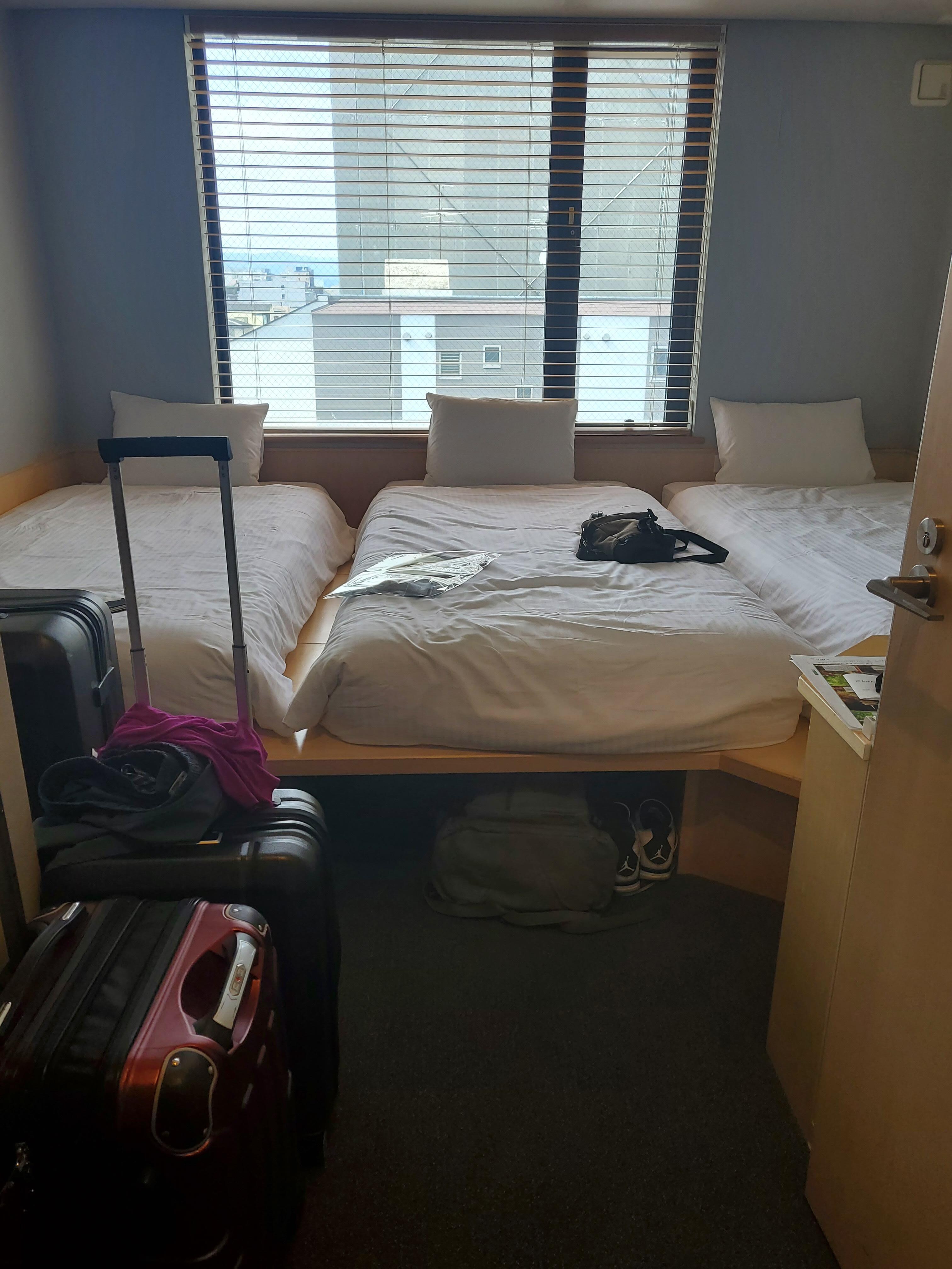5 steps from the door and there's the bed! 3 person room with raised platform beds 