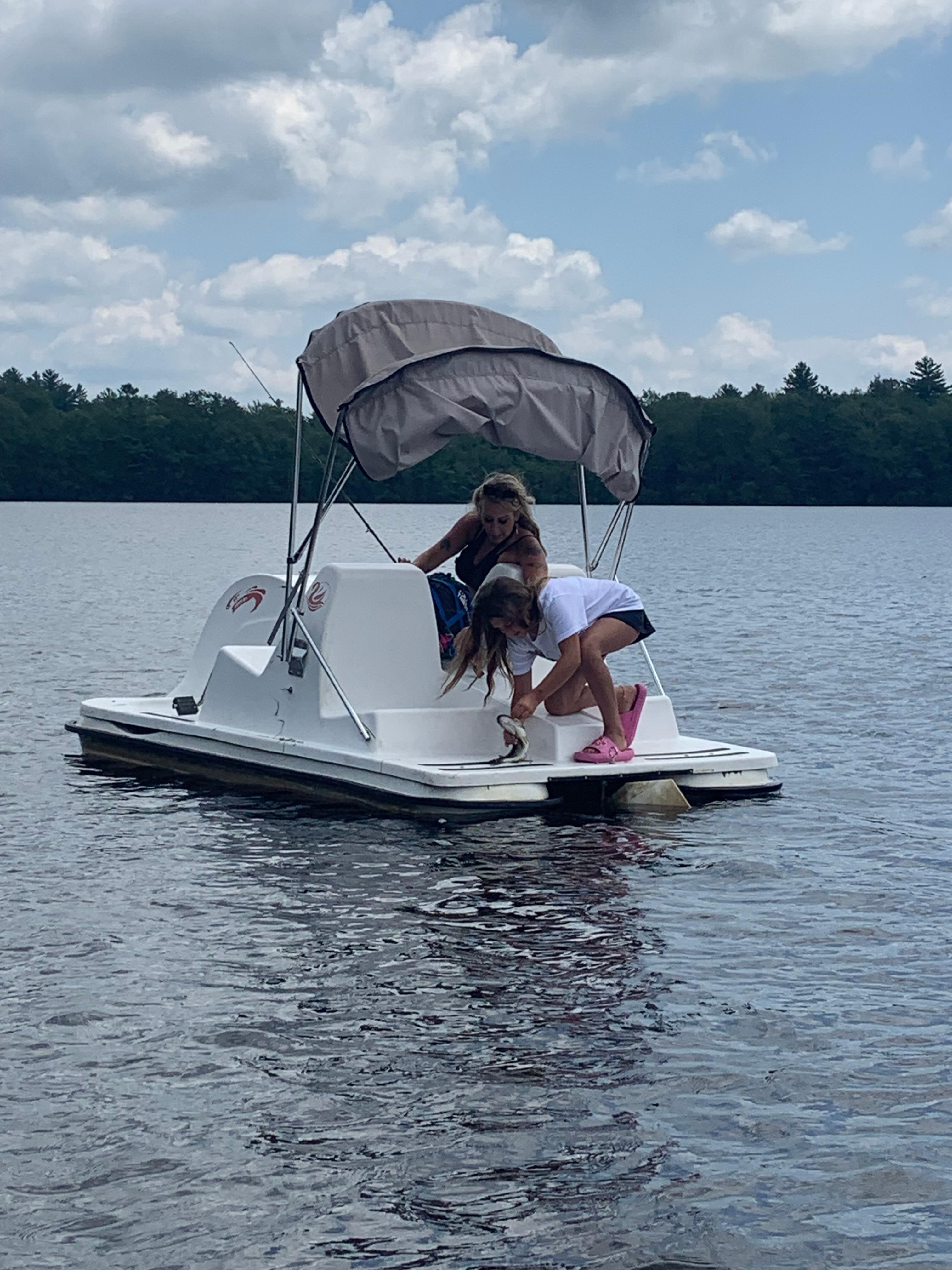 Our granddaughter catching a fish. 