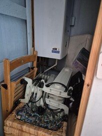 This is the cupboard in the back bedroom and there is a mammoth amount of stuff in the way so we weren't able to use the hanger space.