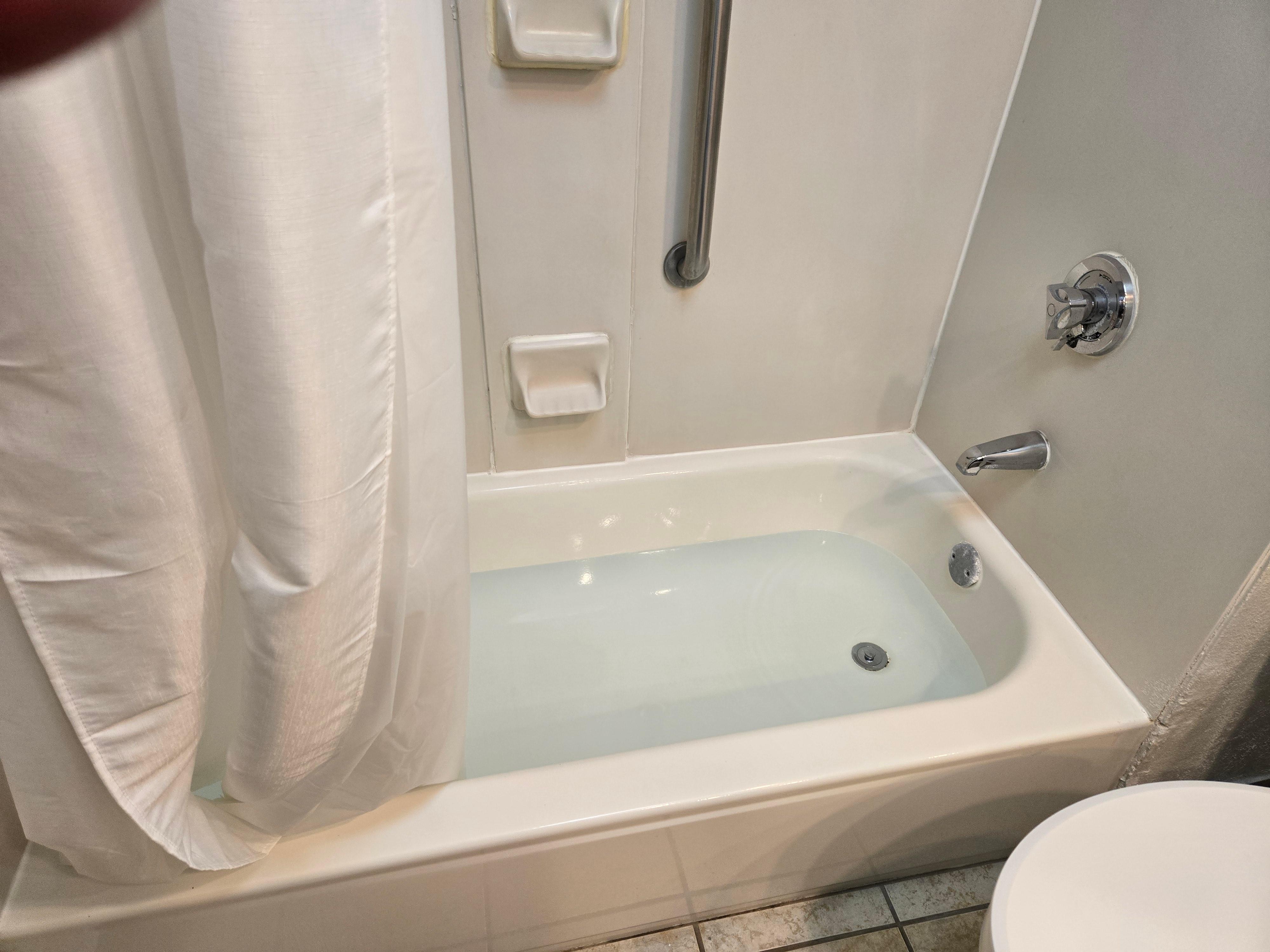 1st room.  Tub is full, Pool is empty. 