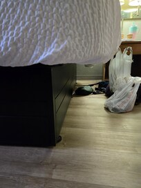 This is how far the mattress hangs over the frame on both sides.