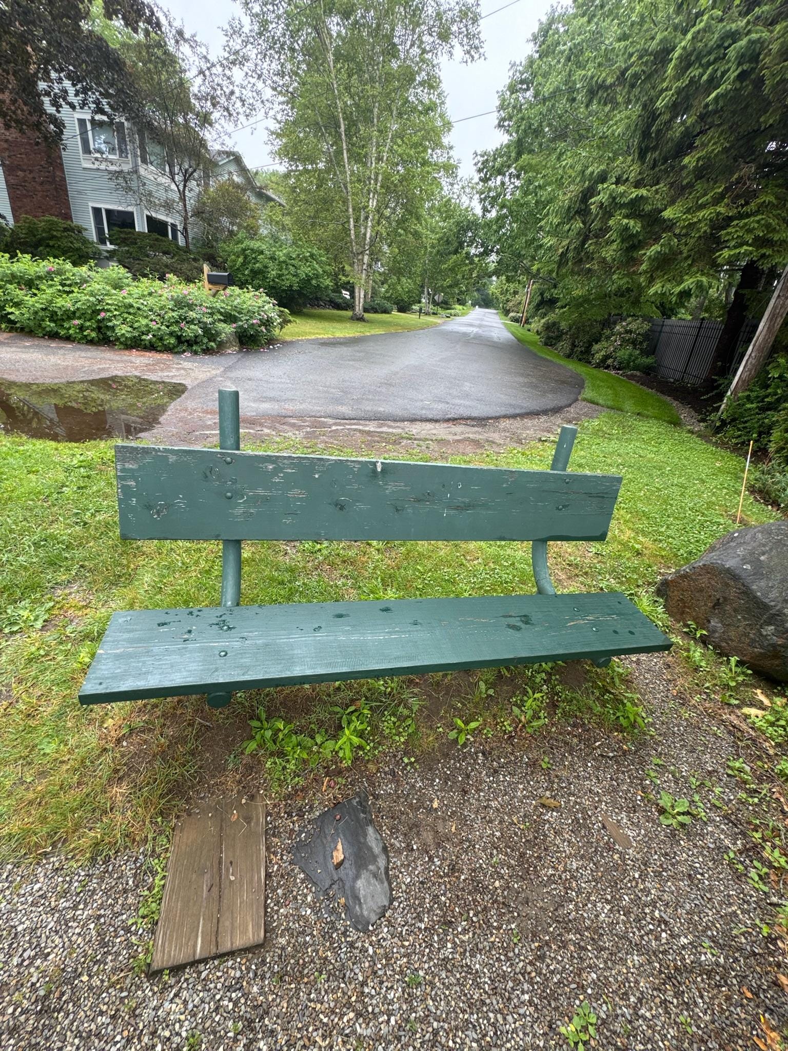 Bench close to house to sit and look out at the harbor. 