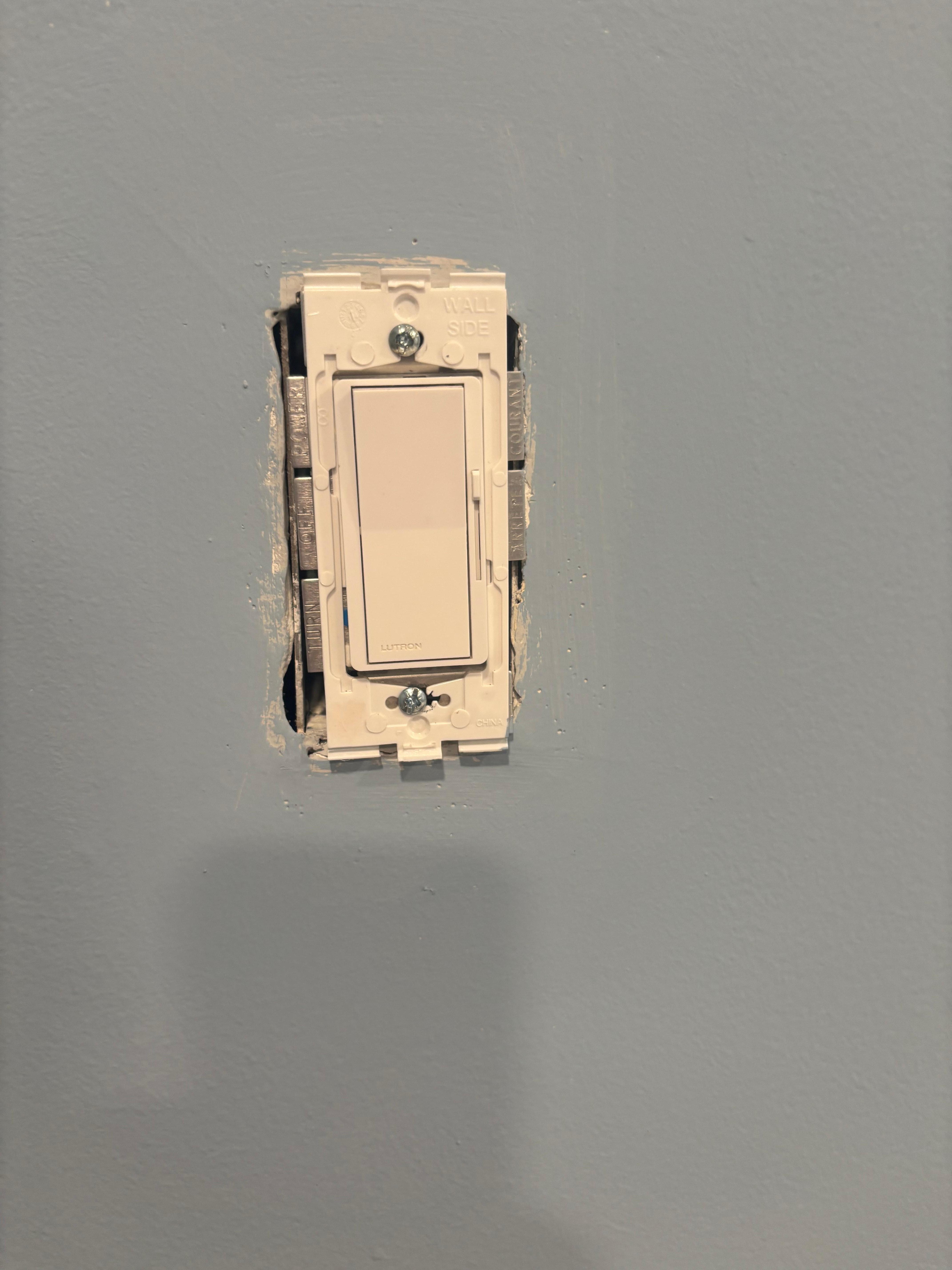 No faceplate on the light switches and exposed wiring