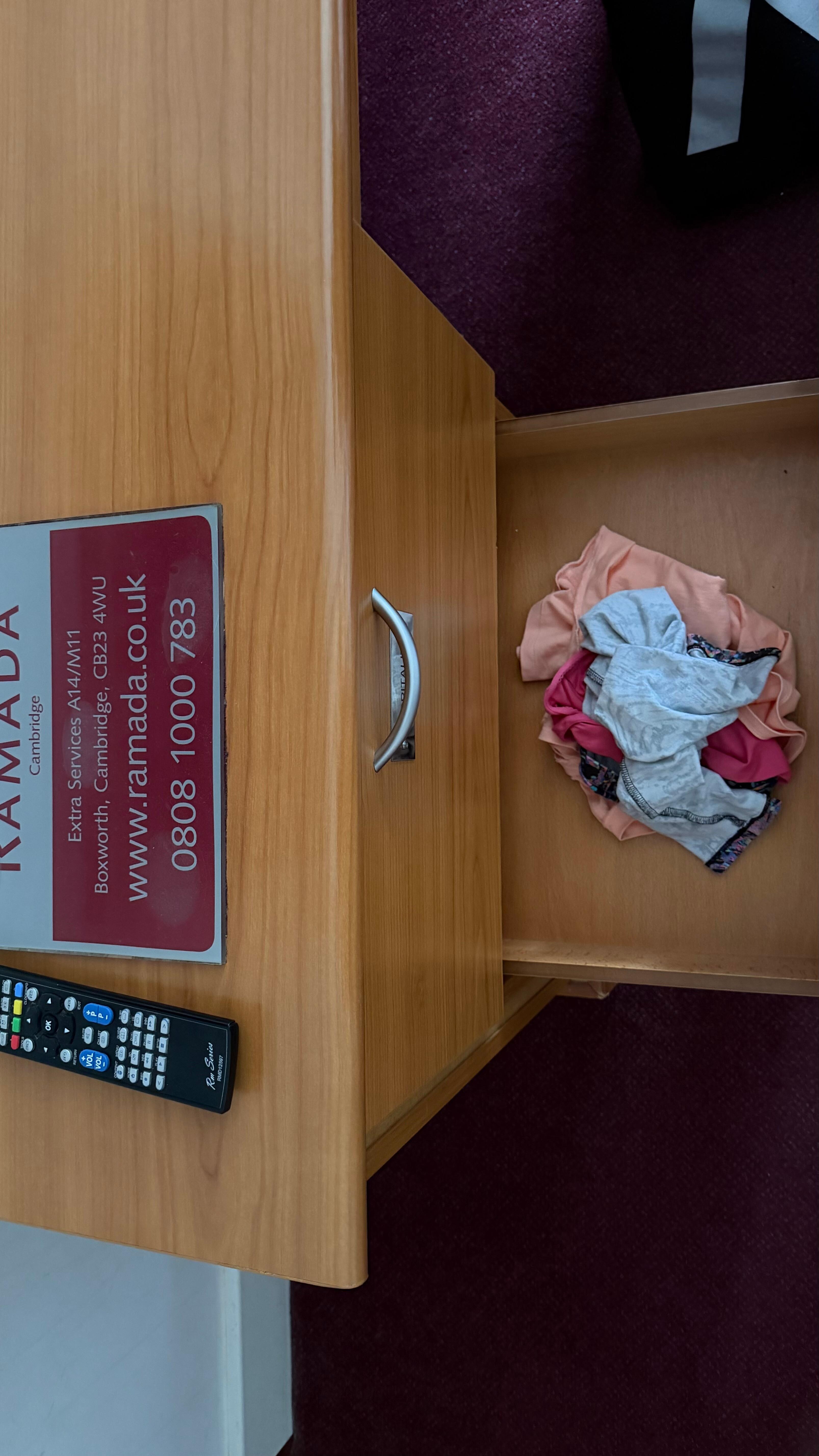 Someone else dirty clothes and underwear left in the room