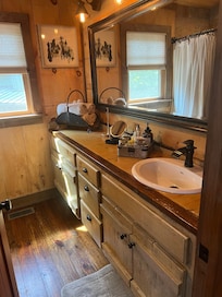 spacious bath well stocked with all necessities.