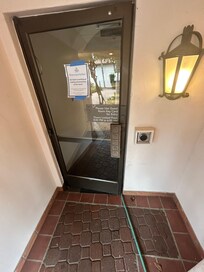 Communal door wouldn’t shut at night due to hose. Unsafe.