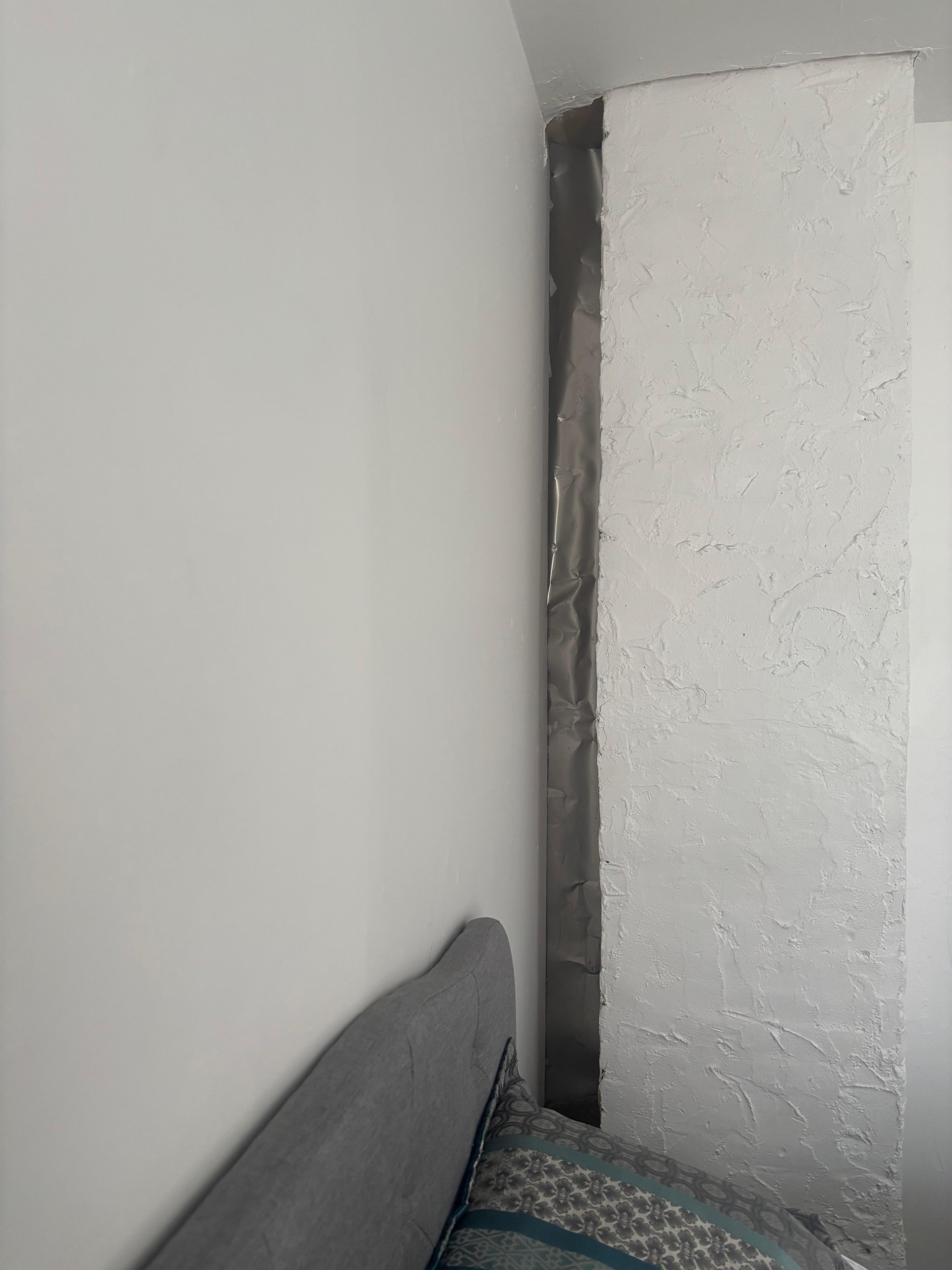 Wall in bedroom behind the fireplace 