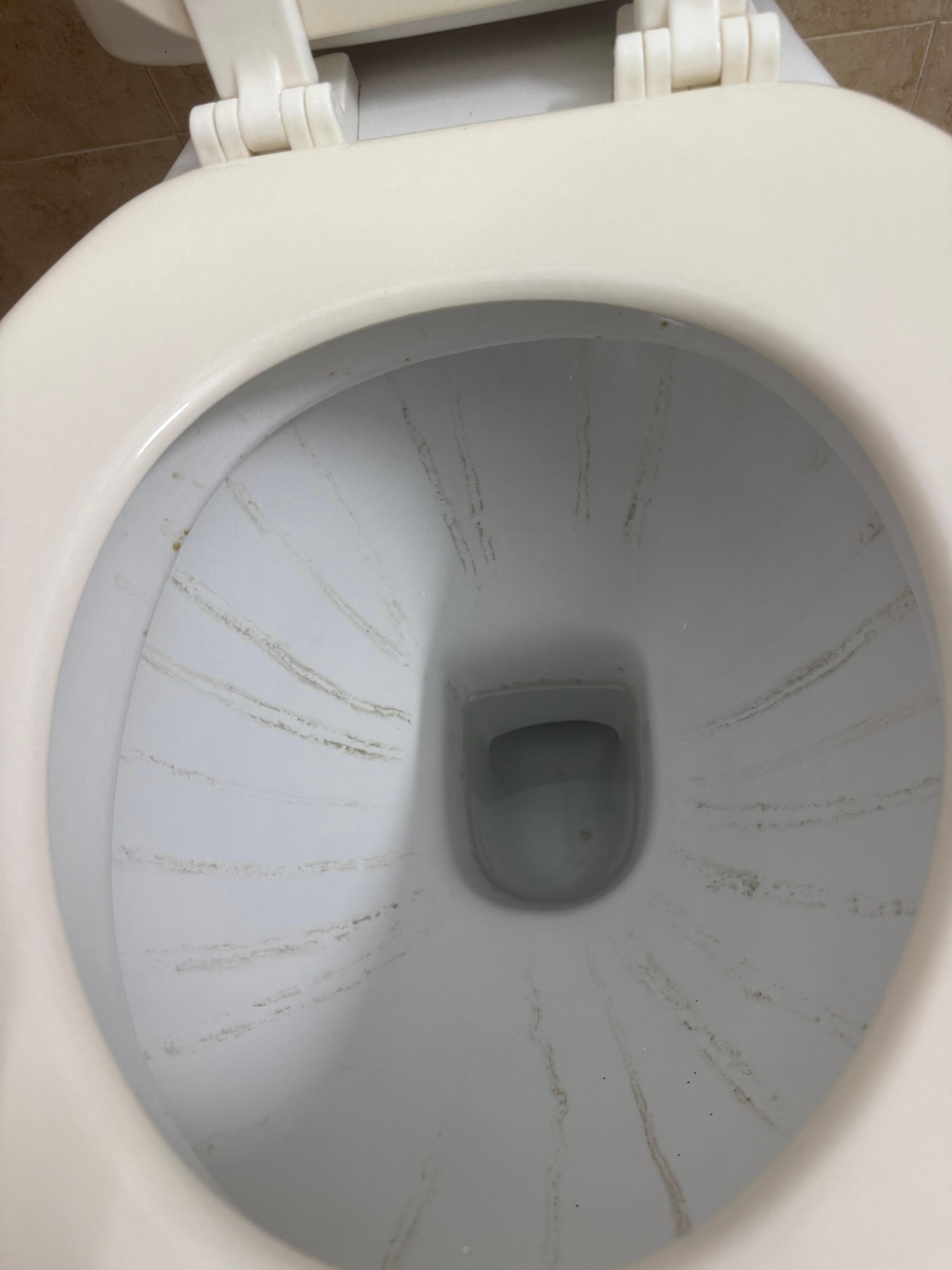 Streaks in the toilet that was not cleaned