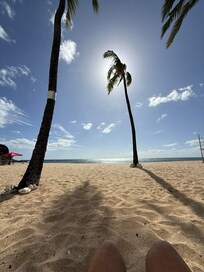 following the shade of the palm trees on the beach out your door