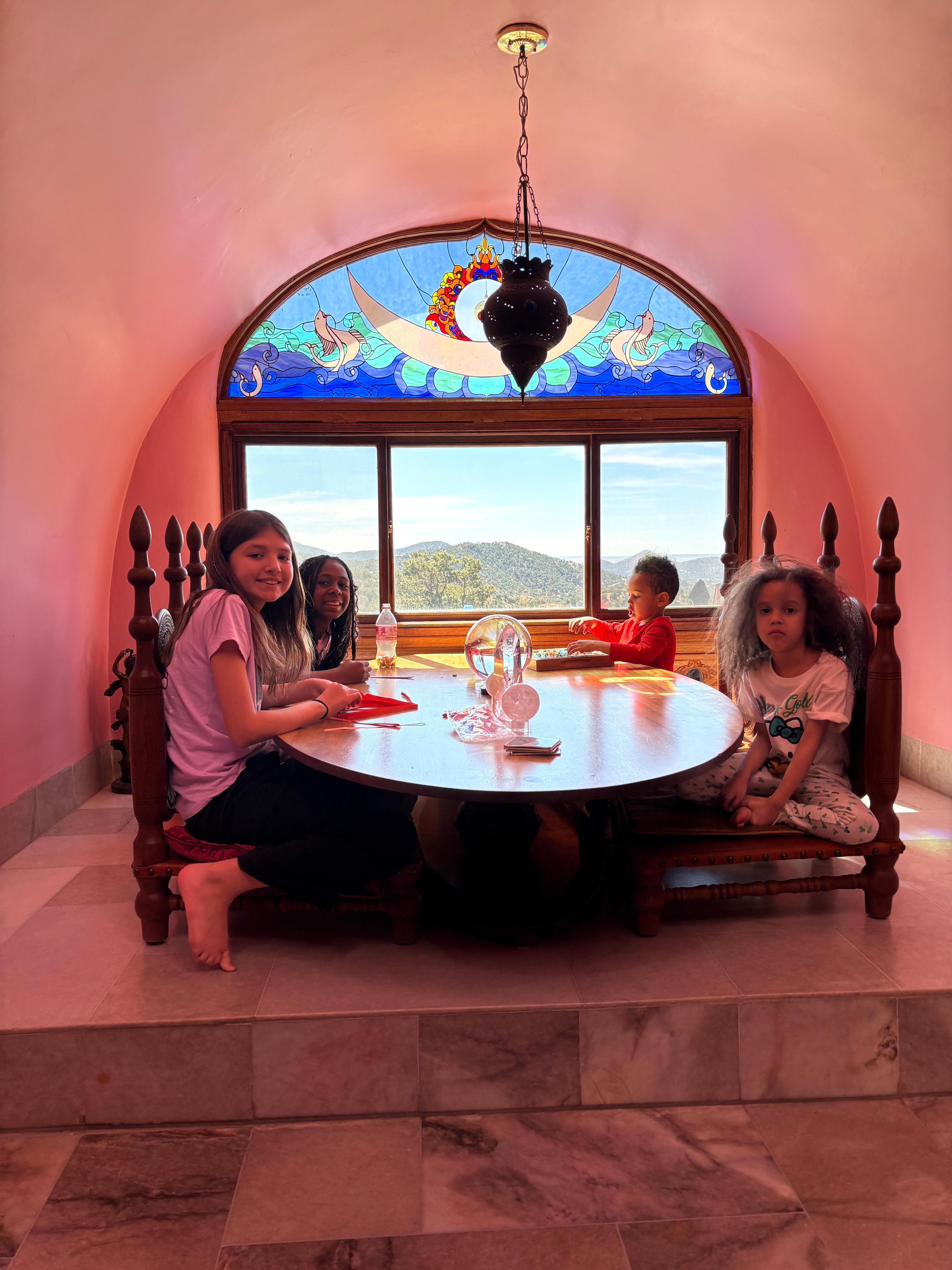 Kids at very cool table with amazing view!