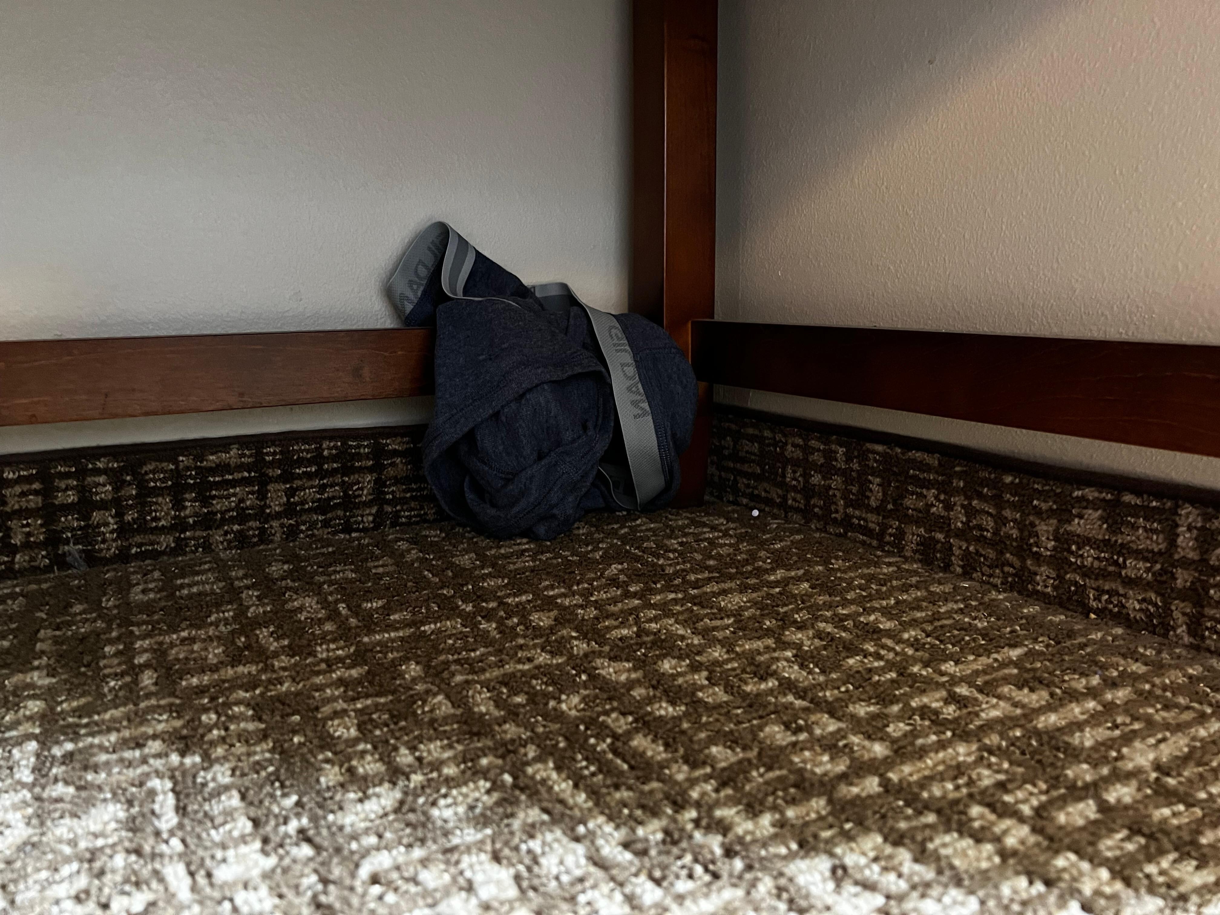 Underwear left underneath the desk.