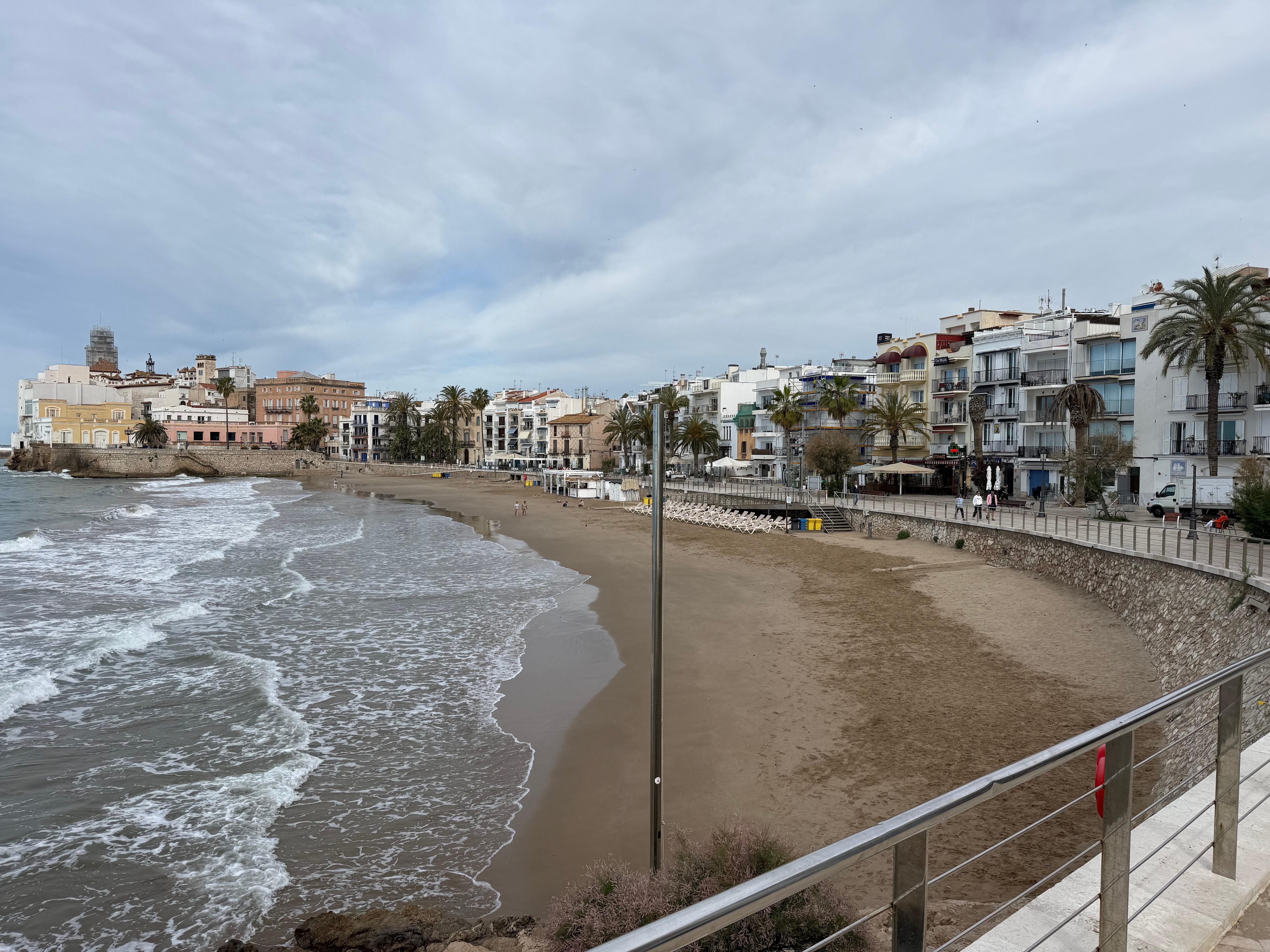 The beach. The hotel is on the right in the middle with the half-round balconies. 