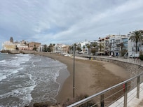 The beach. The hotel is on the right in the middle with the half-round balconies.