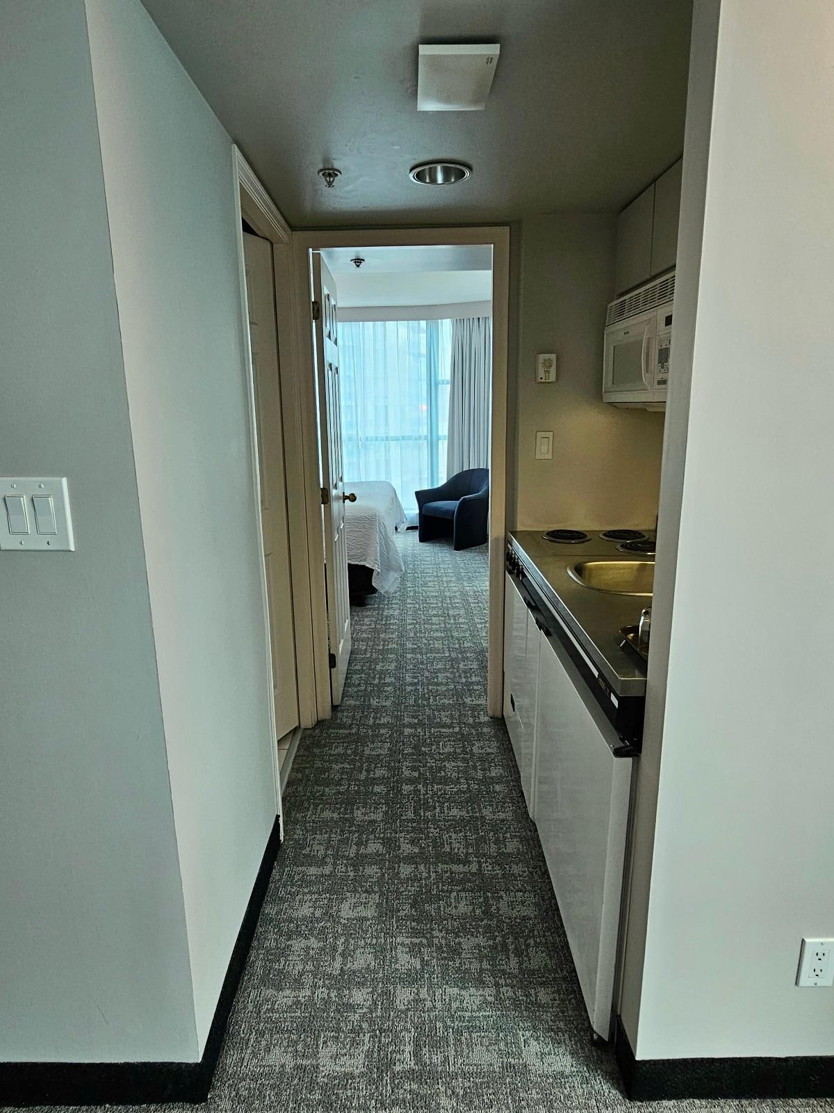 Bathroom to left with well equipped kitchenette area to the right