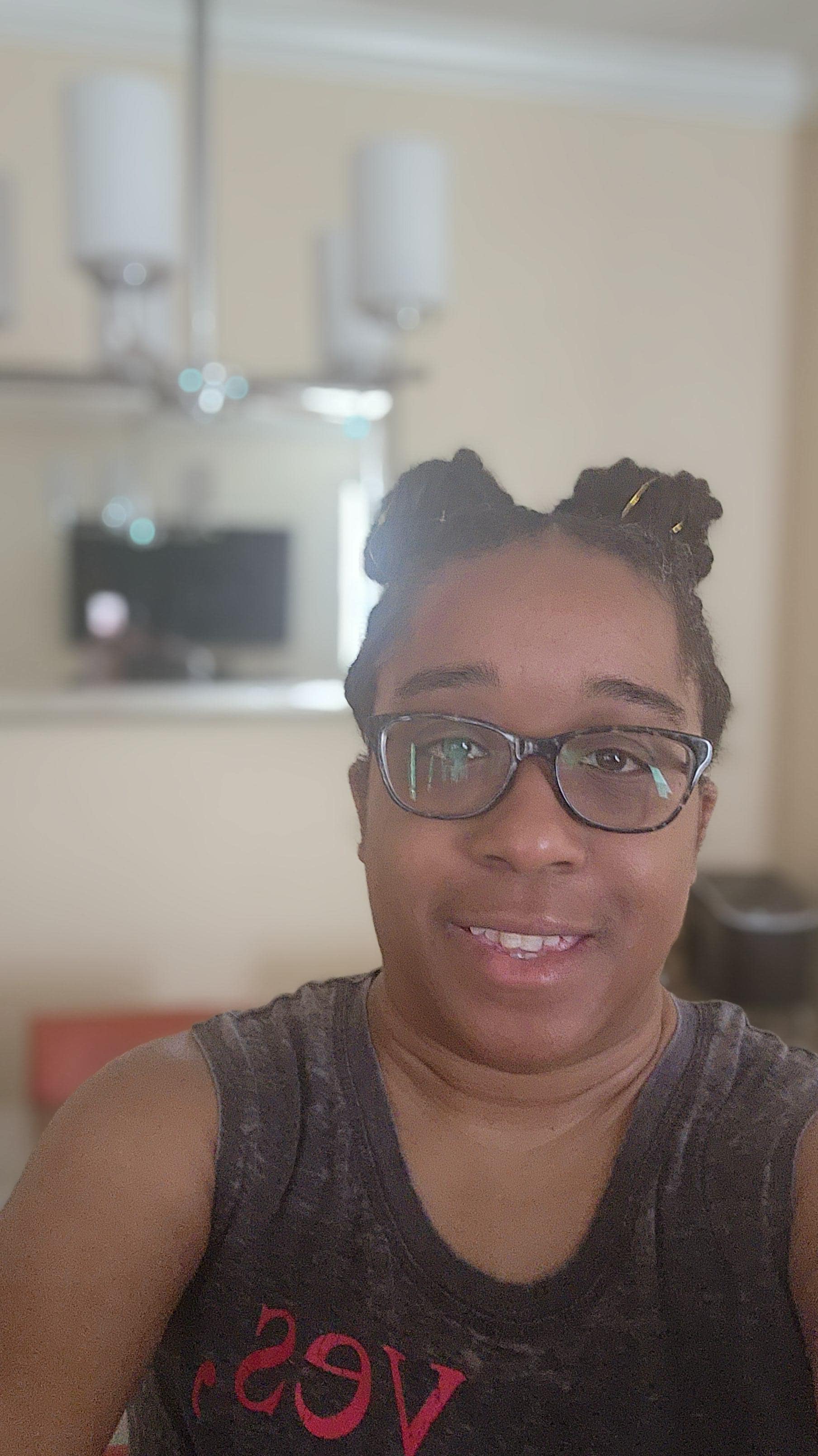 Me taking a picture in the dining room with the nice mirror in the background.