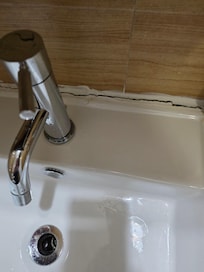 Sink falling off the wall