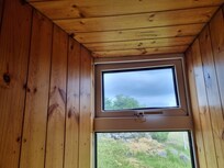 window in down stairs bedroom that looks closed but IS NOT