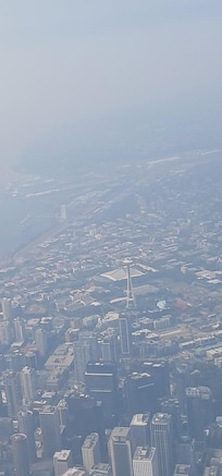 Space Needle on cloudy day from airplane