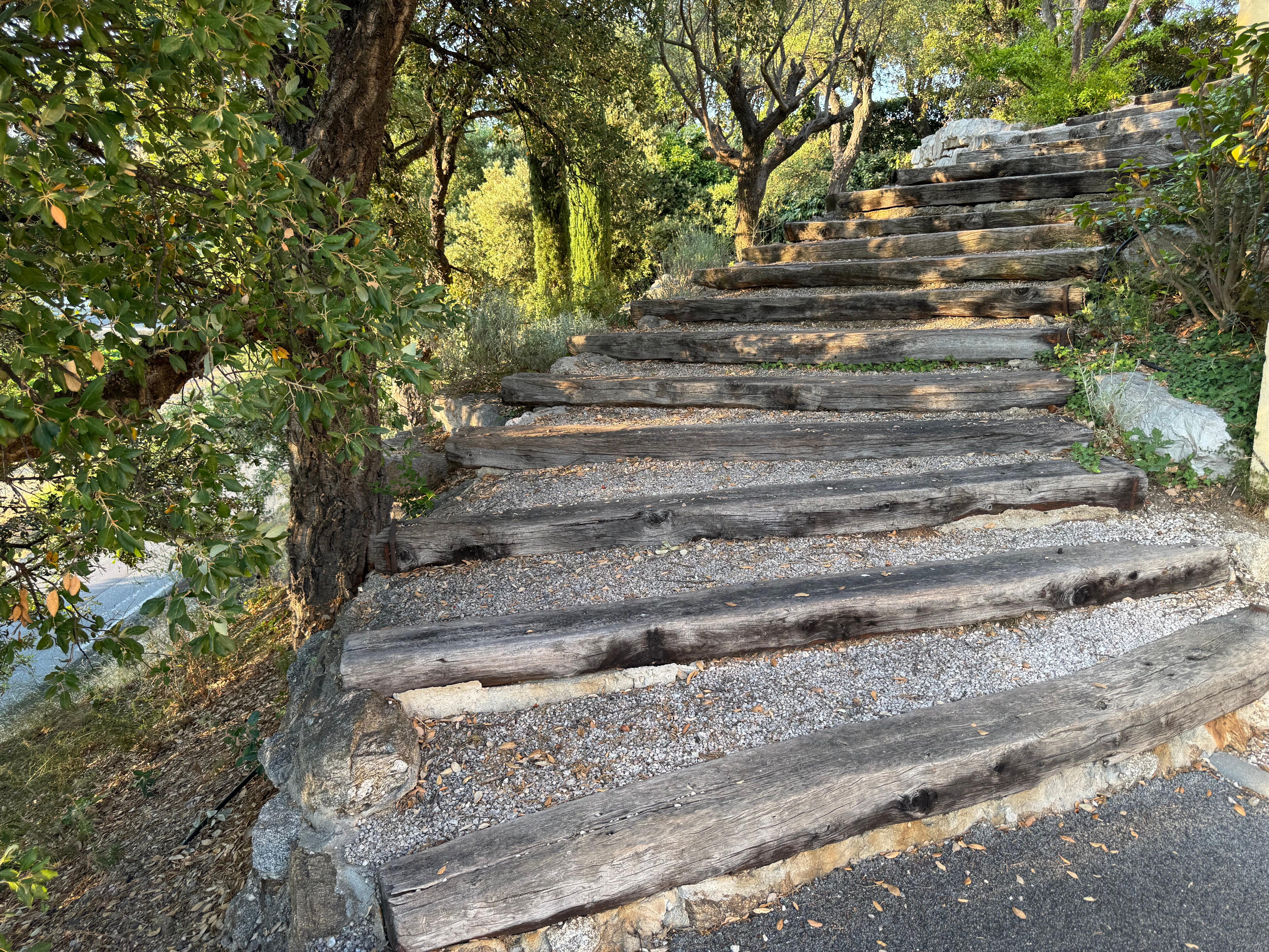 Stairs to front door with steep side drop