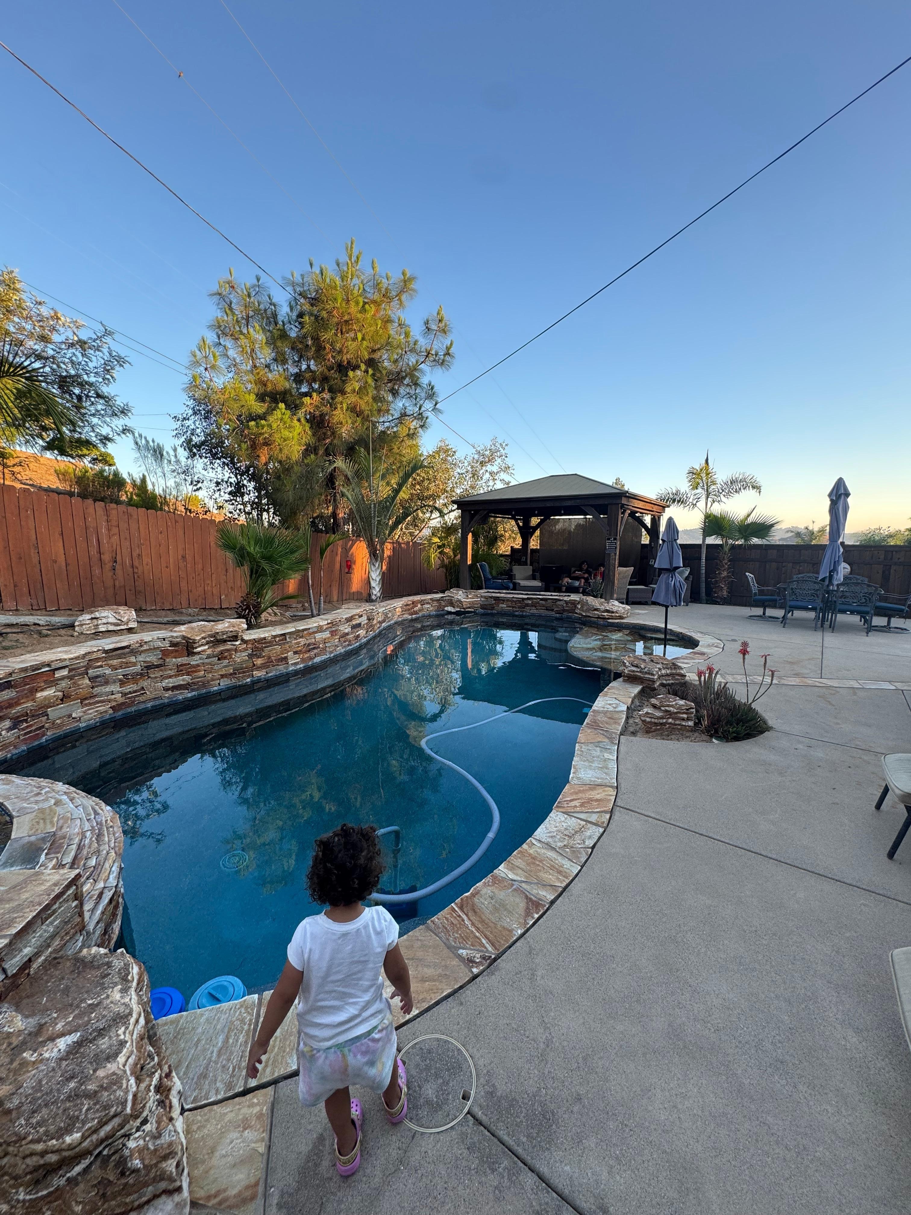 My toddler exploring the pool area