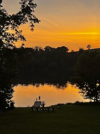 Daddy and son on the dock at sunset