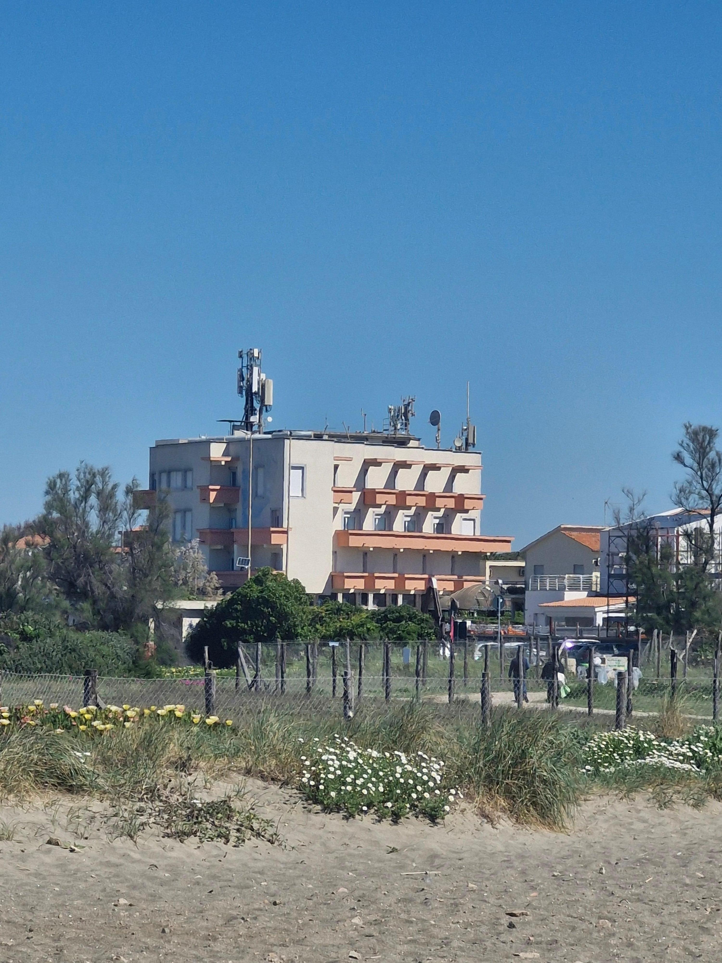 View of hotel from the beach that has public access
