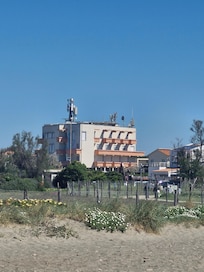 View of hotel from the beach that has public access