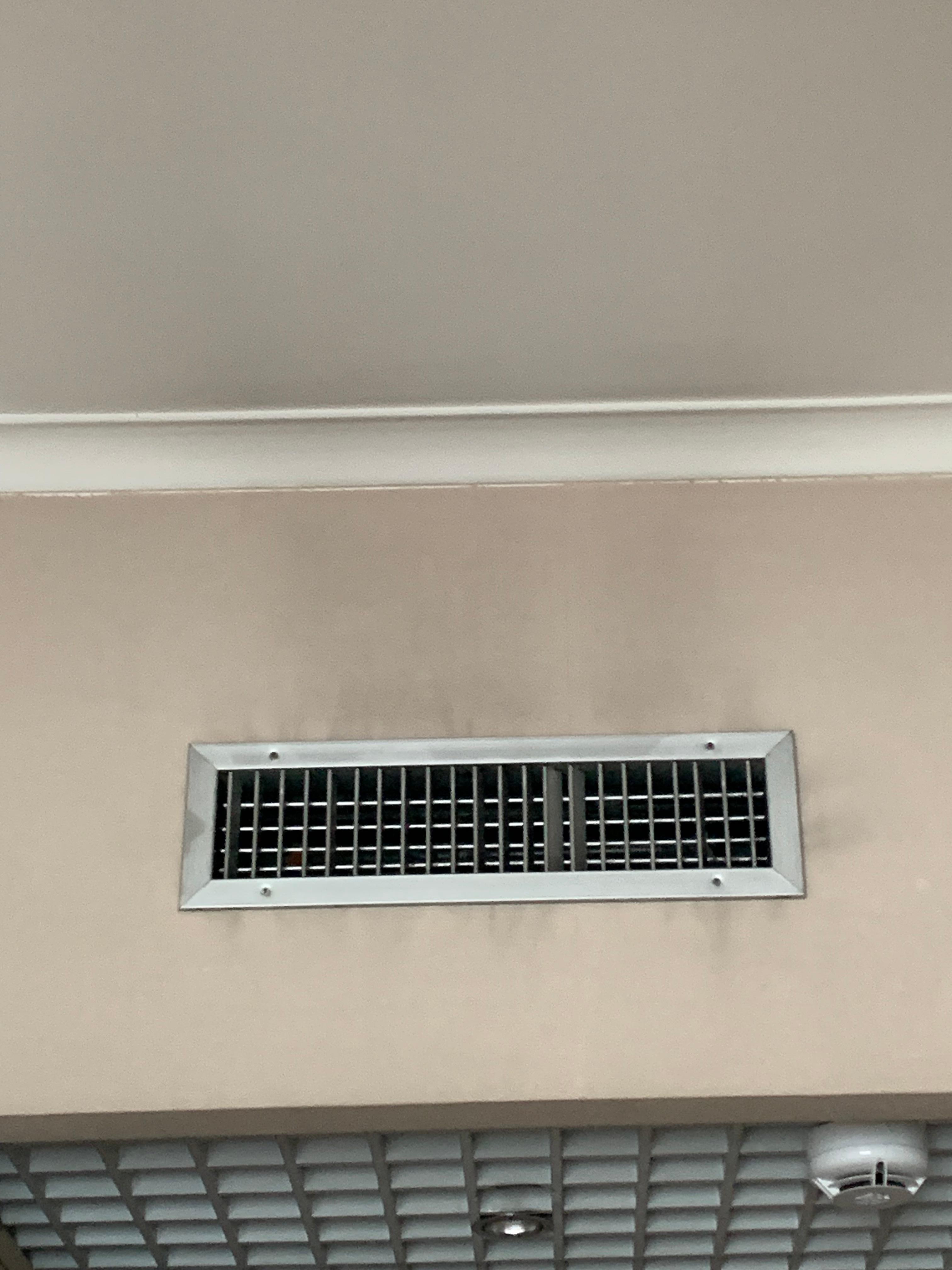 Dirt on ceiling around air vent 