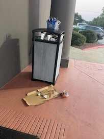 Overflowing trash at entrance