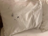 Pillow cases had black stains on them