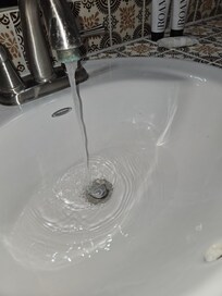 Sink will not drain and has low water pressure.