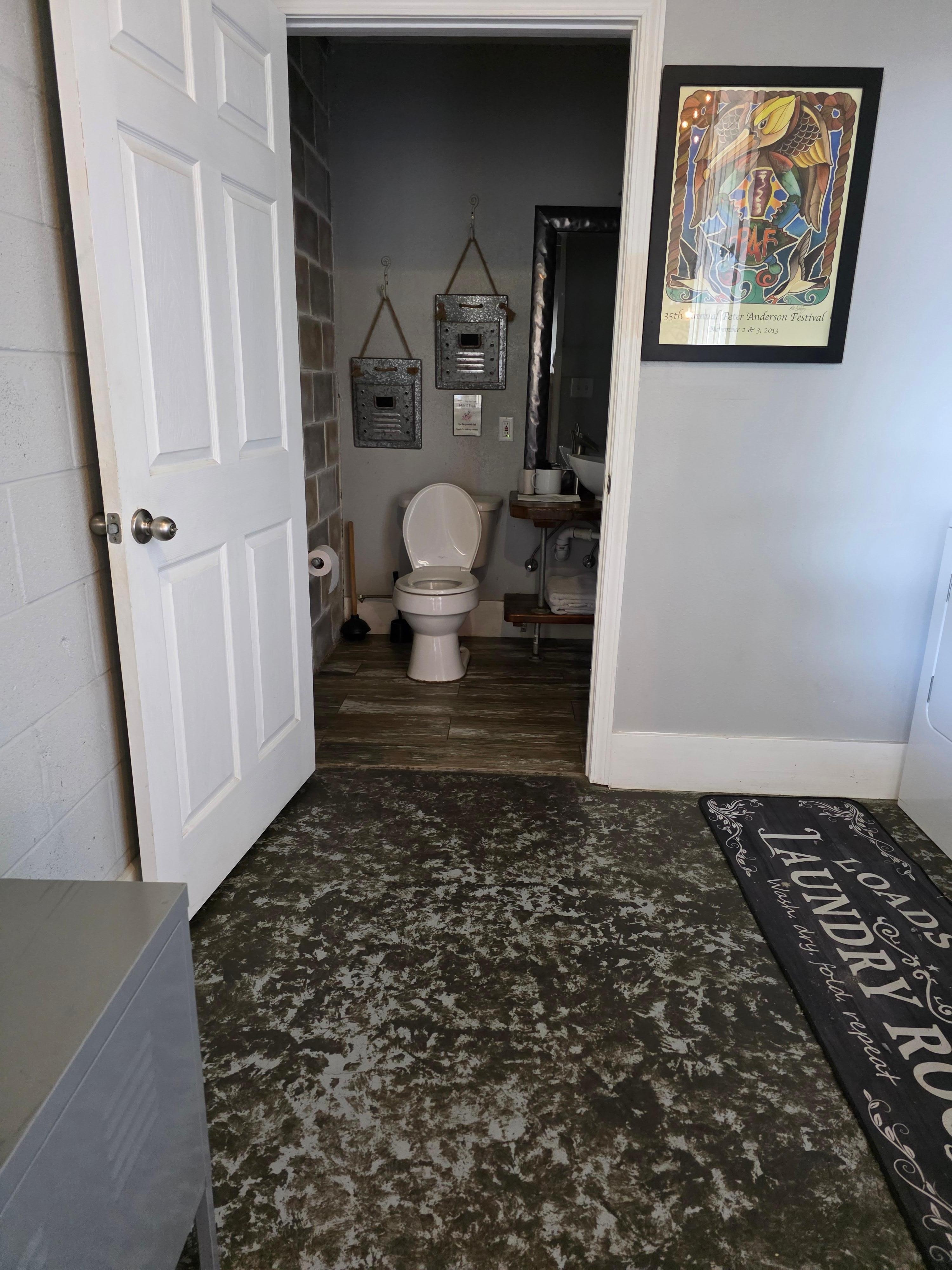 Doorway into laundry bathroom