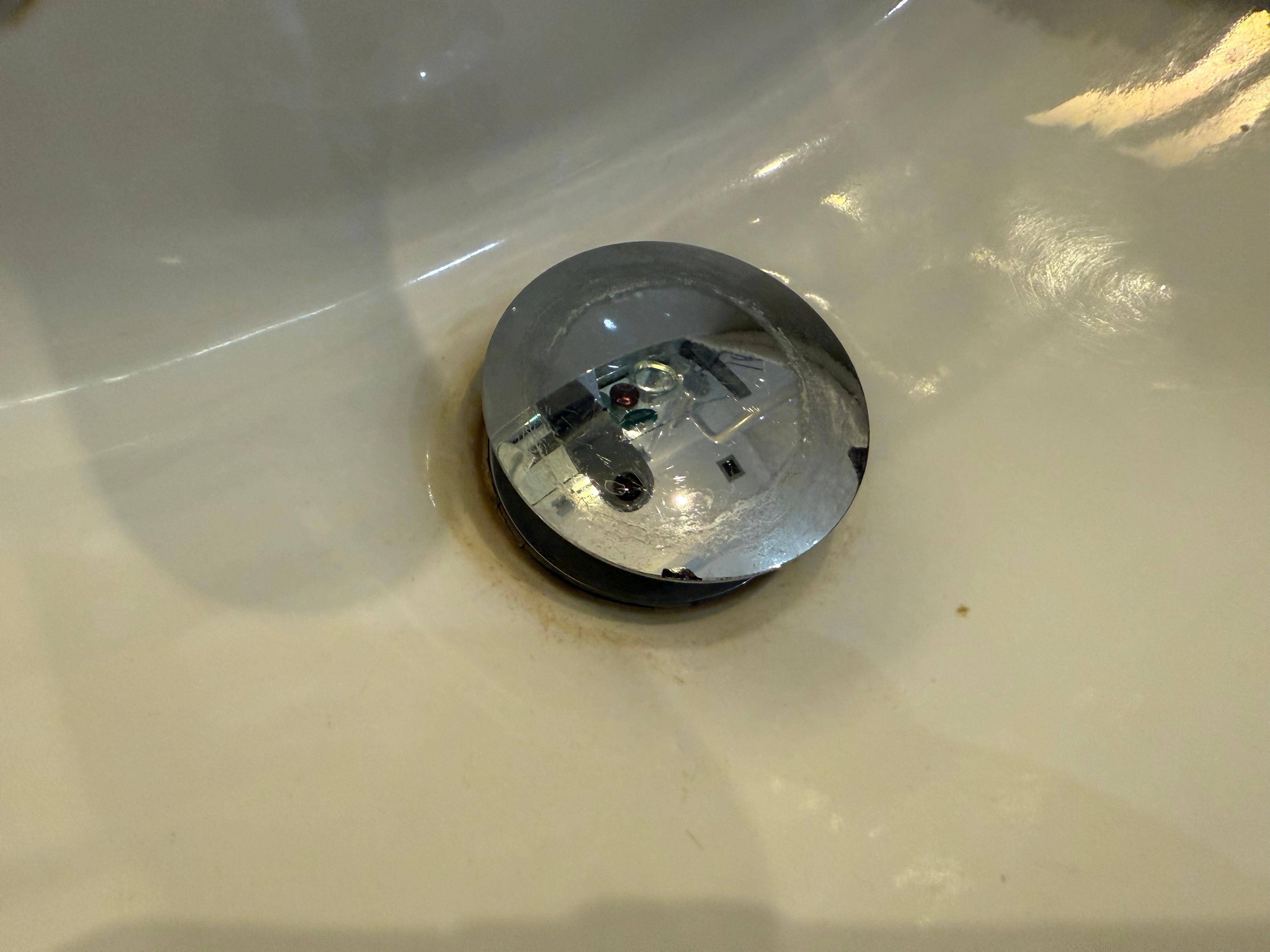 Staining around sink plug 