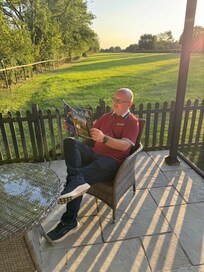 Relaxing in the garden overlooking the bird feeder in the meadow.