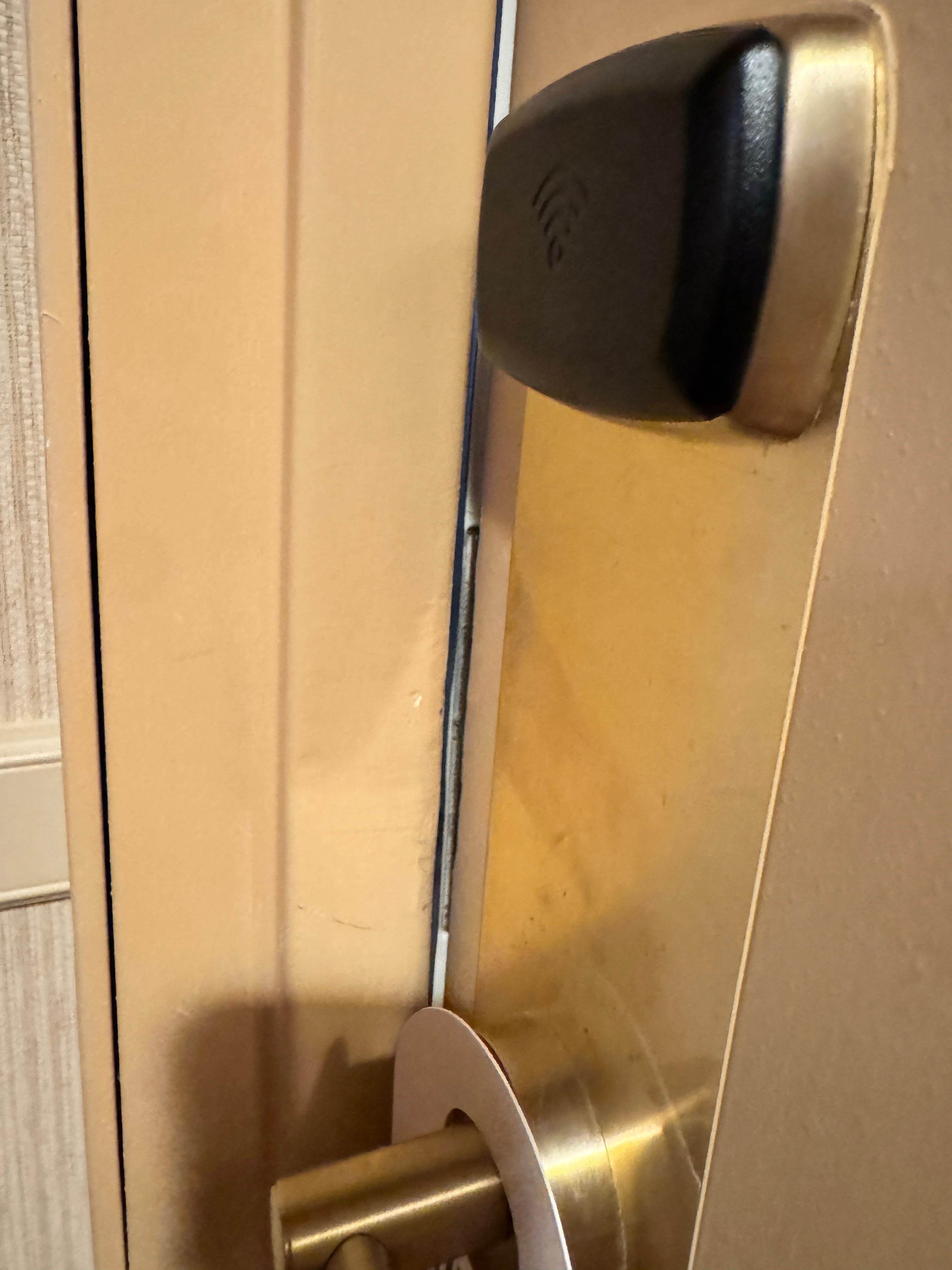 Door frame bent. Door easily opened with any kind of card by just popping it in. We had to switch rooms as a result. We saw rooms all down our hallway with door frames like this.