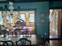 Dining Room looks into the living room and hallway on the right. Lovely sitting porch was to the left of the dining room.