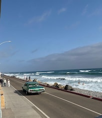 The Strand allows cars to travel across the ocean most of the day.