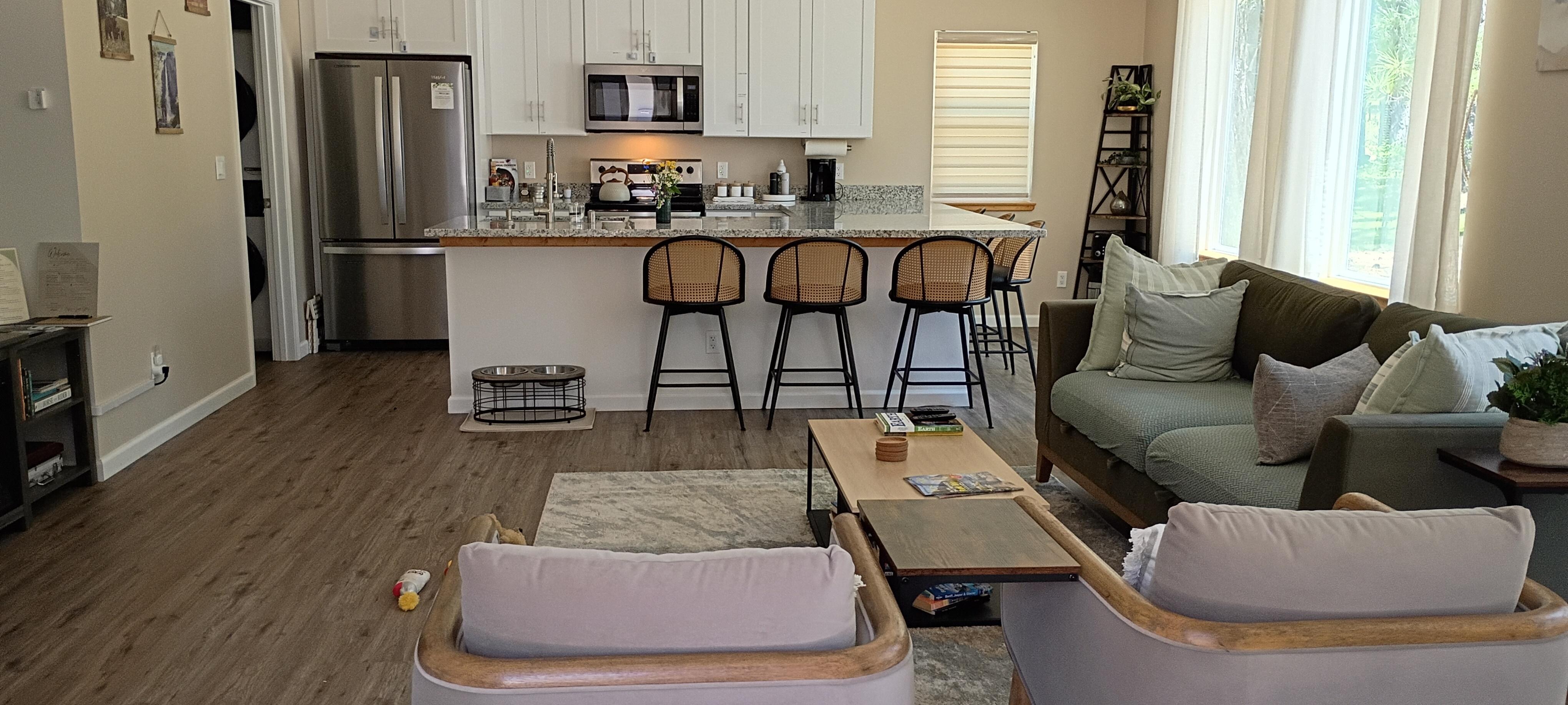 Thelir astounding kitchen and living room combination are nicely designed for a true rest and relaxation time with love ones, including furry family members.The place has so much light around the property.