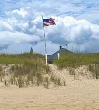 View of house while standing IN the ocean.