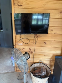 The tv is small, the cords hang down and it’s not moveable!/adjustable. .